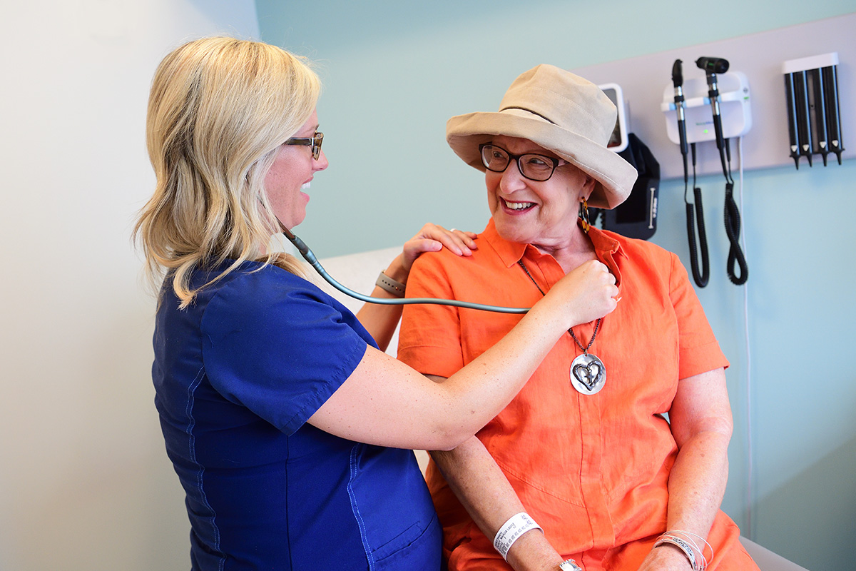 Patient Marcia Causey with oncology nurse Caitlyn Ciochetti.