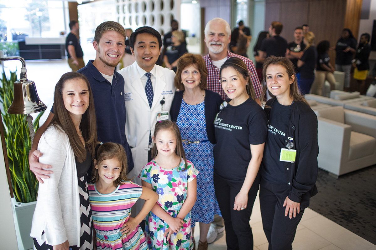 Stephen Brinkman with his family and proton therapy care team.