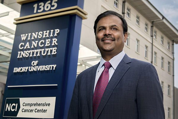 Suresh Ramalingam, MD, outside the entrance to Winship Cancer Institute