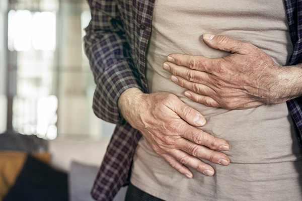 Senior man is suffering stomach pain (stock image)