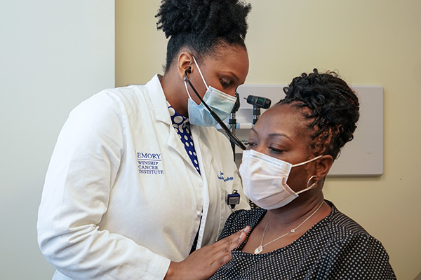 Dr. Jade Jones examining a patient