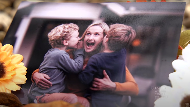 Image of a photo of a young mother with her two sons