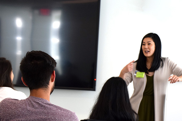 Lecturer presenting to a group of students