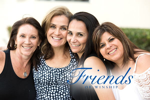 Candid image of four women with Friends of Winship logo in foreground (stock image)