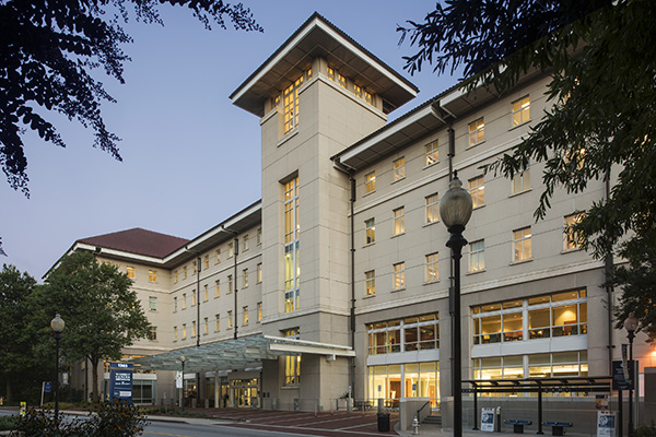 Winship Cancer Institute building C on Clifton campus at dusk.