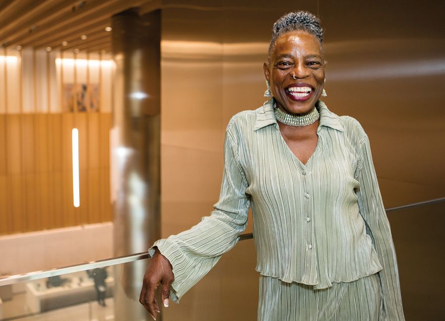 a portrait of an african american woman smiling at the camera.