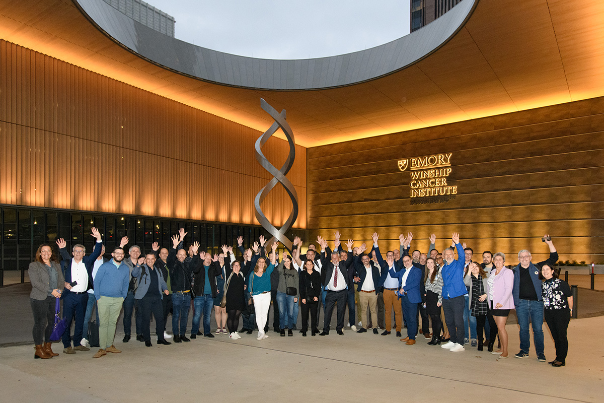 Forty health professionals, clinicians and journalists from France and Belgium in the valet area of Winship Cancer Institute at Emory Midtown.