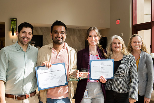 Winship Postdoctoral Scholar Program award recipients Tarun Bhatia, PhD, and Celina Jones, PhD, with their mentors.