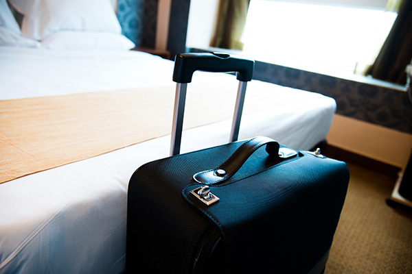 Luggage bag at the end of a hotel bed (stock image)