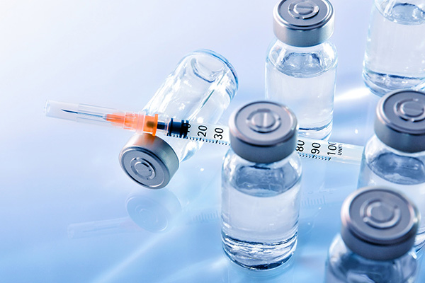 Medication vials and a syringe (stock image)
