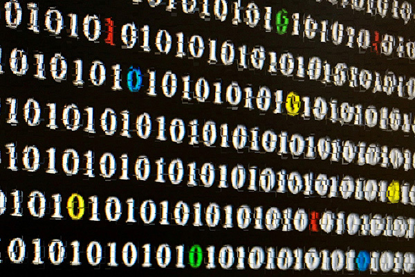 Close up of monitor depicting binary code (stock image)