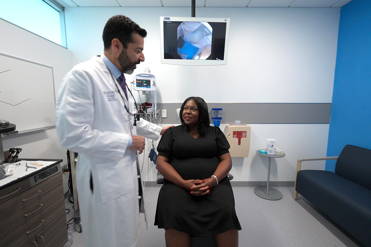 Dr. Mark El-Deiry in exam room with a patient