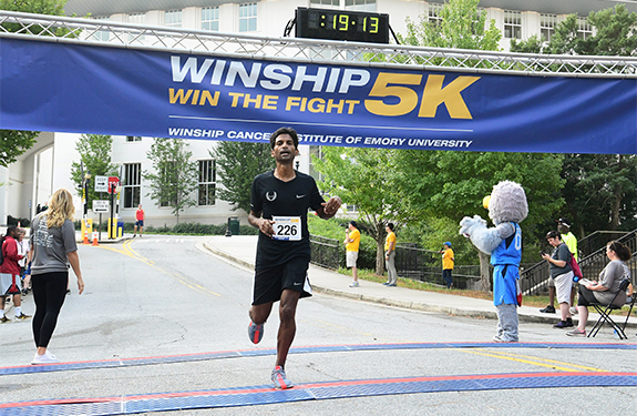 Mihir R. Patel, MD, crossing the Winship 5K finish line
