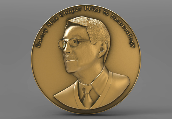 Gold medal depicting Max Cooper, MD, with the words Emory Max Cooper Prize in Immunology