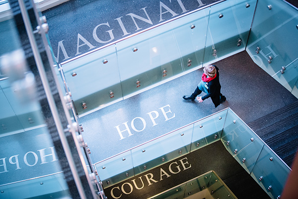 Stairwell at Winship's Clifton campus location with the words Hope, Imagination and Courage visible on each floor landing